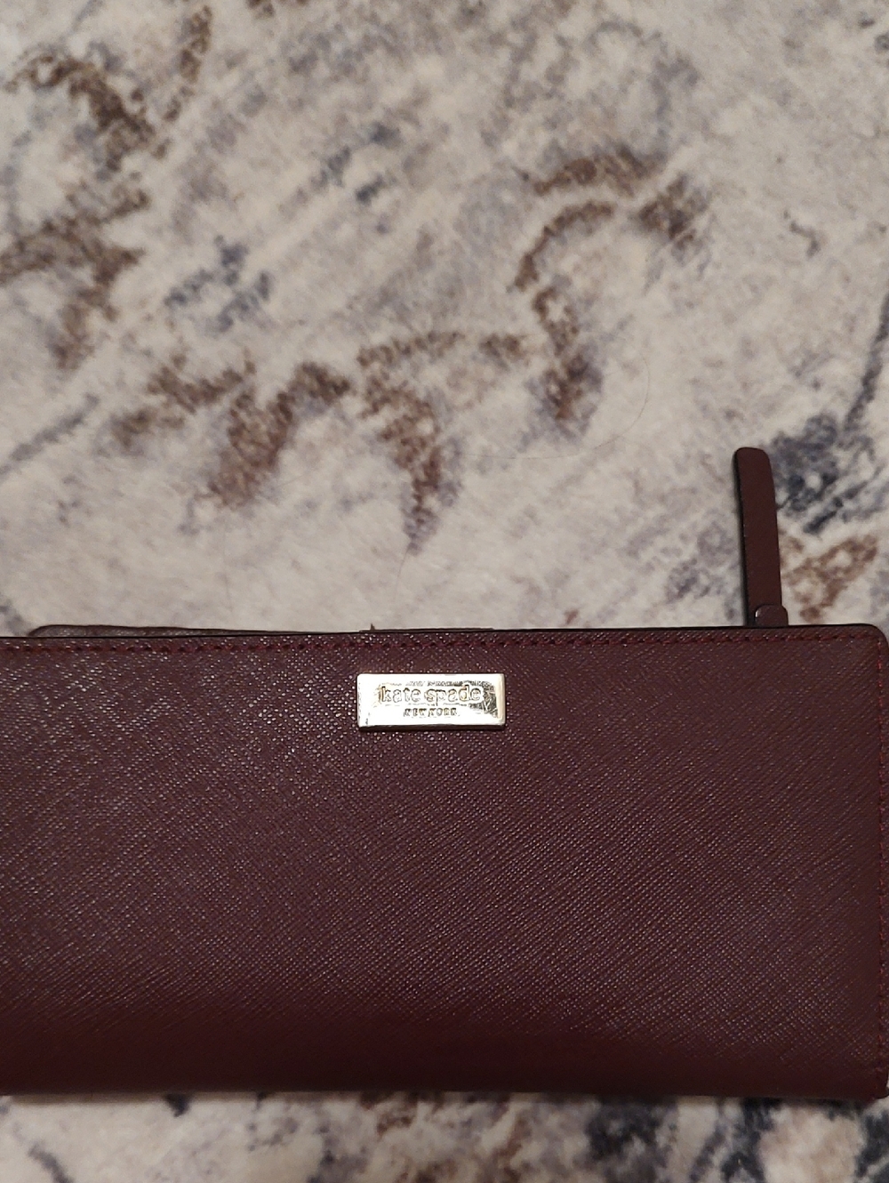 kate spade burgundy zip wallet with gold plaque